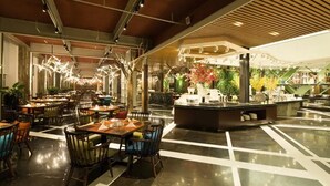 A spacious indoor area with multiple dining tables and chairs, a central counter with plants, and a modern ceiling design. - Beijing Chunhuiyuan Hot Spring Resort Hotel (Beijing)
