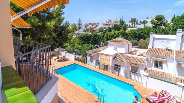 A rooftop swimming pool with a view of surrounding buildings and trees. - Mediterraneo 20E by Casasol (Nerja)