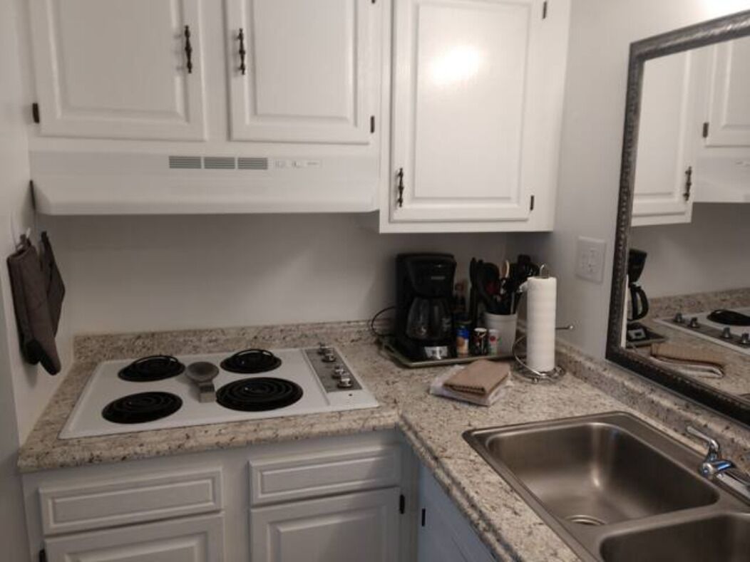 Fridge, microwave, coffee/tea maker, cookware/dishes/utensils