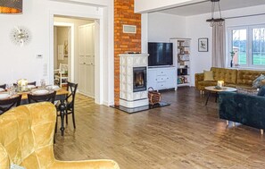 Smart TV, fireplace, video game console, table football