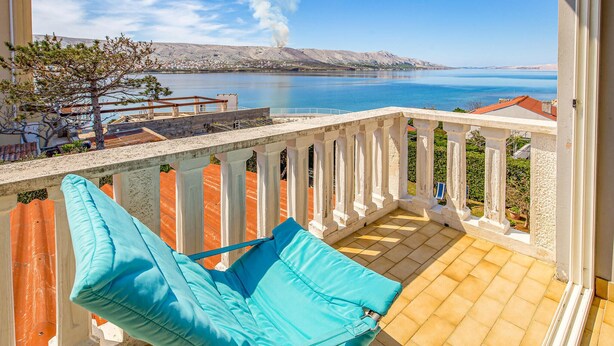 A balcony with a view of a calm sea and distant hills. - 2 bedroom lovely apartment in Pag (Pag)