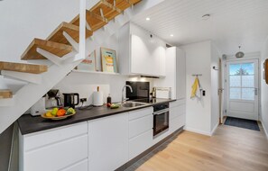 Fridge, stovetop, dishwasher, coffee/tea maker