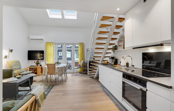 Fridge, stovetop, dishwasher, coffee/tea maker