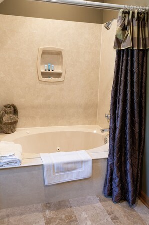 Combined shower/bathtub, hair dryer, towels, soap