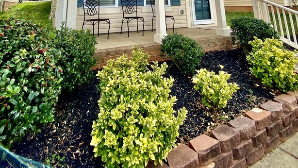 A two-story house with a front porch, a covered entryway, and a brick foundation. - Quiet and Beautiful House in a WONDERFUL location near 2 Lakes and Charlotte! (Huntersville)