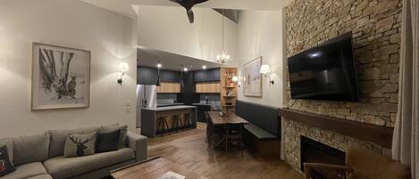 Smart TV, fireplace, books, stereo