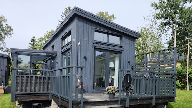 A modern two-story house with a balcony, a front door, and a small porch area. - Willa anna b by Interhome (Kemiönsaari)