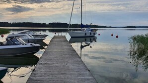 A wooden dock with several boats moored at the end. - Willa anna b by Interhome (Kemiönsaari)
