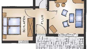 Distribución de una habitación de hotel con cama, escritorio, silla, sofá y ventana.
