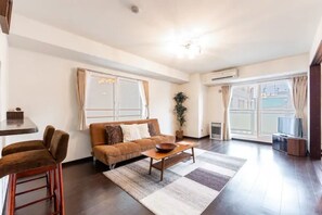Apartment, Non Smoking | Living area | Flat-screen TV