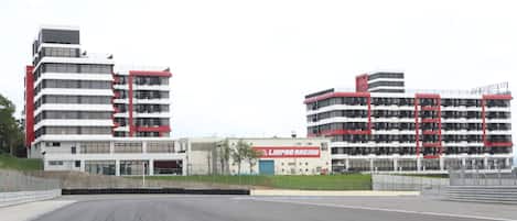 A modern building with multiple floors and a prominent red and white color scheme.