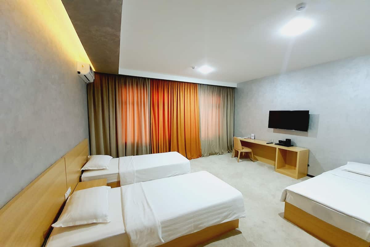 Deluxe Triple Room | Premium bedding, laptop workspace, blackout drapes, soundproofing