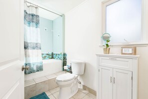 Bathtub, hair dryer, towels