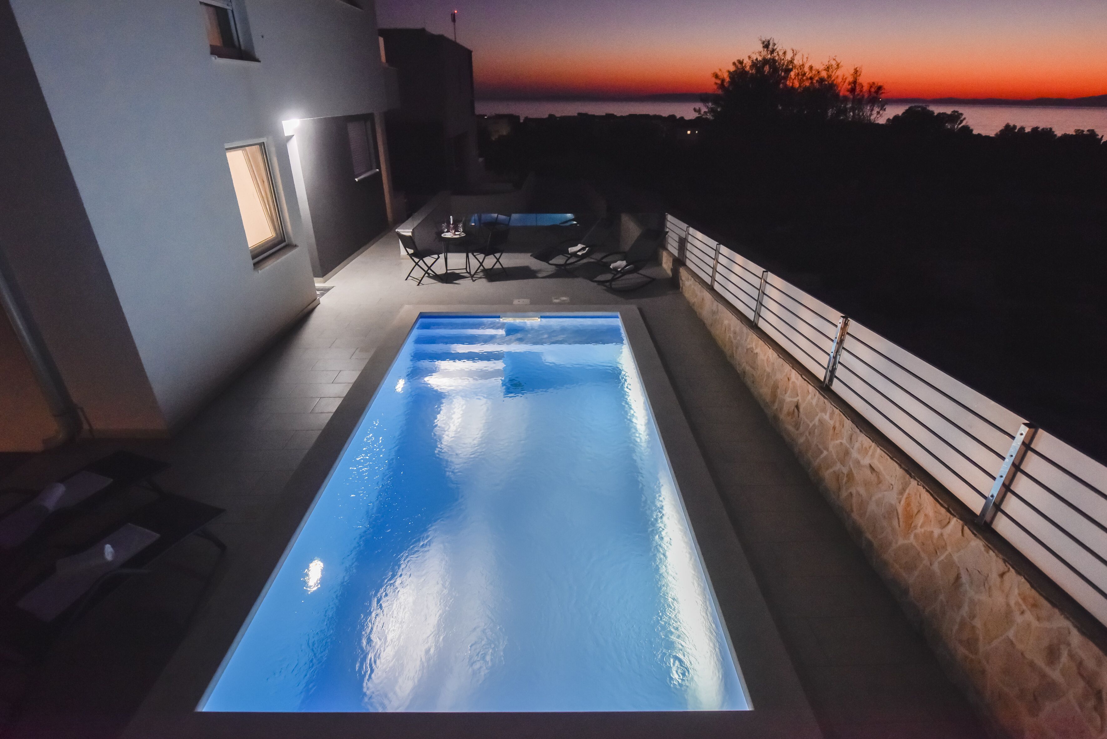 Seasonal outdoor pool, open 9:00 AM to 9:00 PM, pool umbrellas