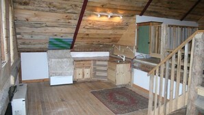 A rustic kitchen with wooden beams, a built-in sink, and a small staircase. - Lake Eden/Expansive Multi-Level (Eden)
