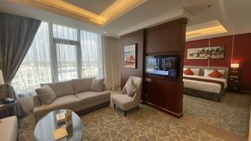 Junior Suite | Living area | 43-inch LED TV with satellite channels, TV