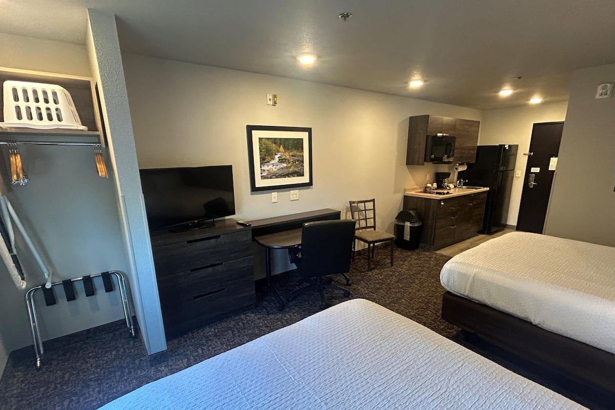 Premium bedding, pillow-top beds, desk, laptop workspace