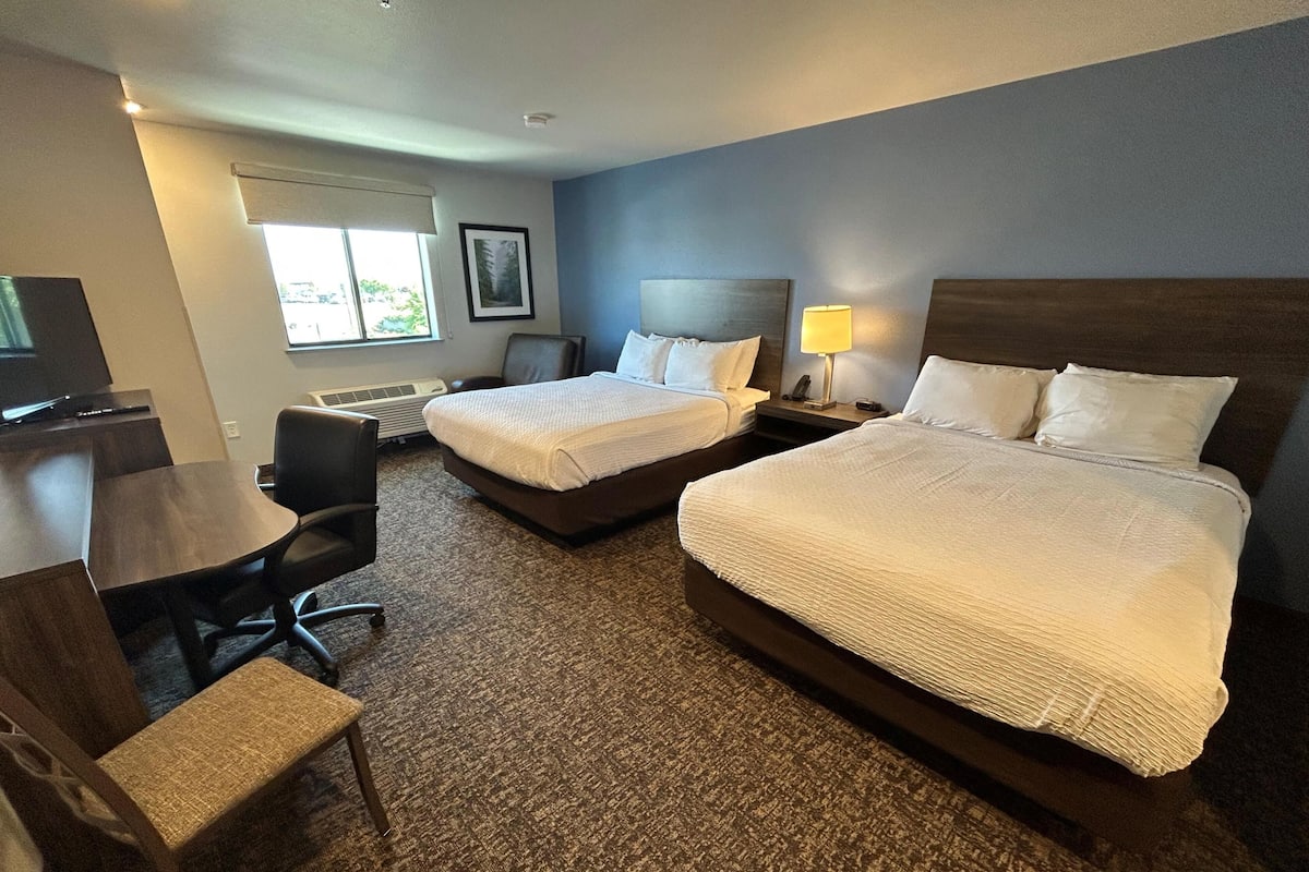 Premium bedding, pillow-top beds, desk, laptop workspace