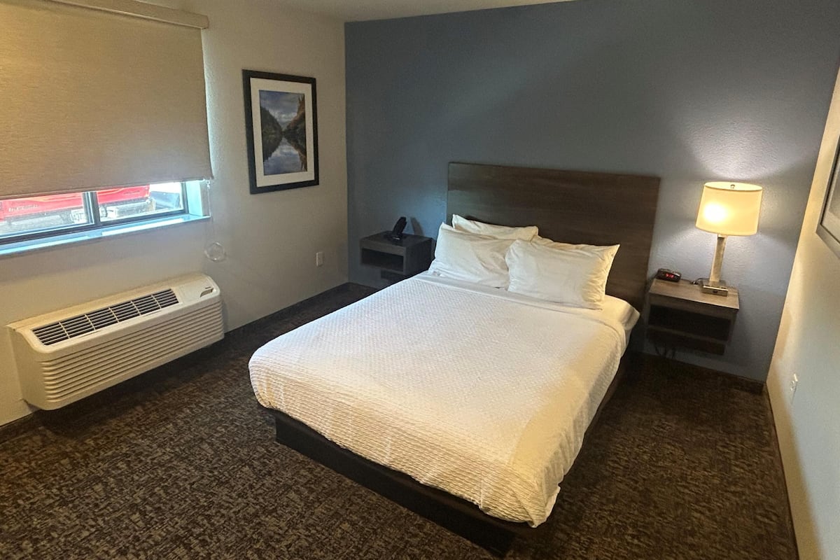 Premium bedding, pillow-top beds, desk, laptop workspace