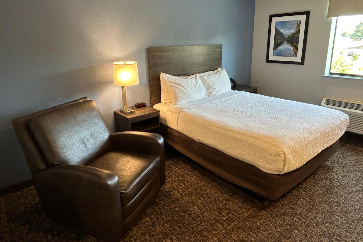 Premium bedding, pillow-top beds, desk, laptop workspace