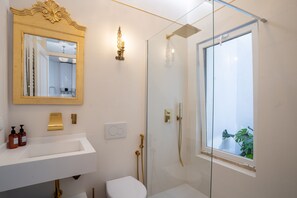 Shower, hair dryer, towels, soap