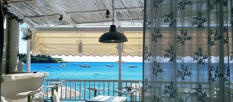 By the Sea beachfront luxury apartment with a large patio