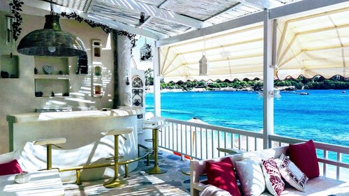 By the Sea beachfront luxury apartment with a large patio