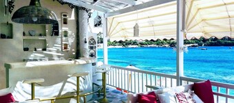 By the Sea beachfront luxury apartment with a large patio