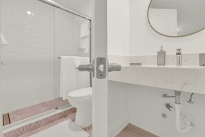 Shower, hair dryer, towels, soap