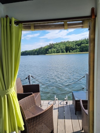 Property grounds. Boat 'Priepert 2' on the Mecklenburg Lake District with Covered Terrace