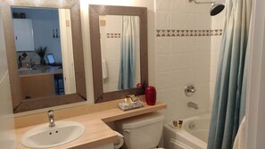 Bathtub, hair dryer, towels, soap