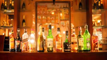 A bar with various liquor bottles displayed on shelves.
