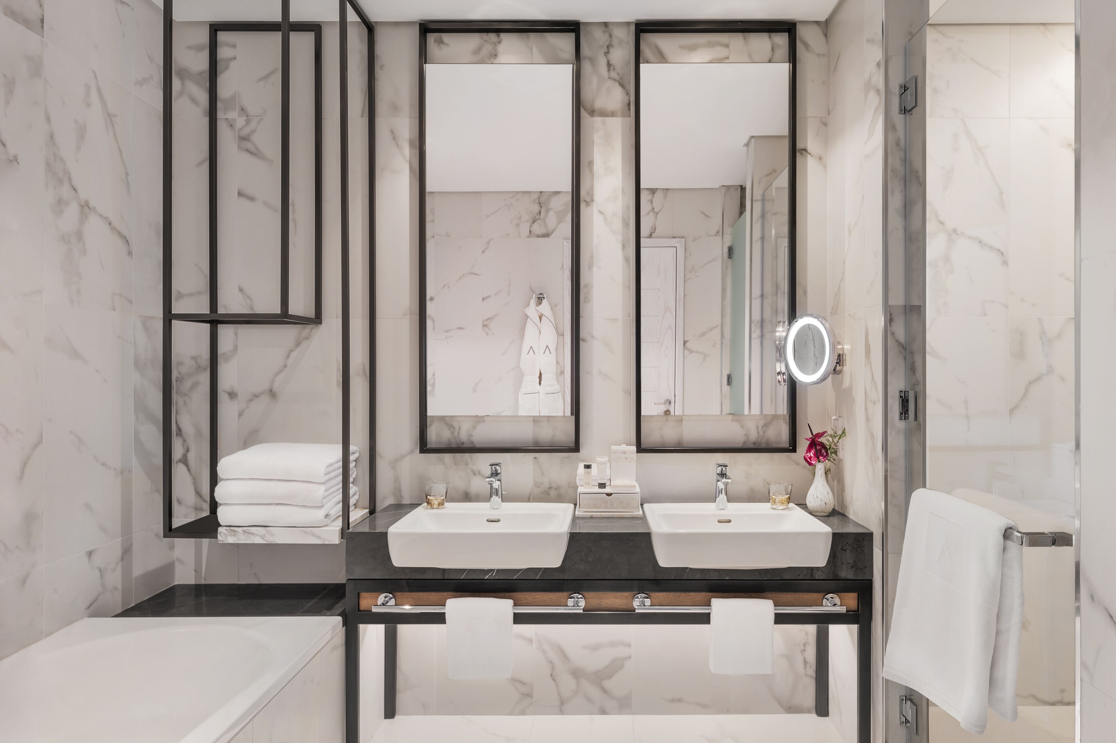 bathtub, hair dryer, bathrobes, slippers