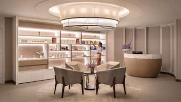 Experience the elegant lobby, featuring a stunning chandelier, comfortable seating, and a welcoming reception area.