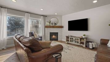 TV, fireplace, books, offices
