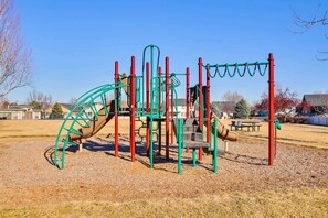 A playground with climbing structures and slides.