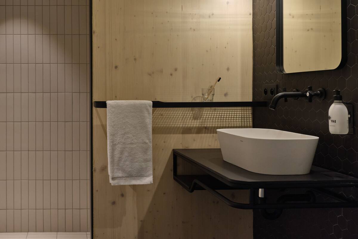 shower, rainfall showerhead, hair dryer, towels