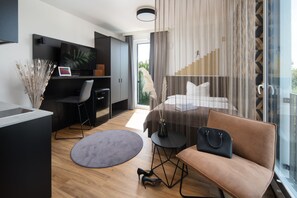 Business Room, Non Smoking, Kitchenette | Down comforters, desk, laptop workspace, blackout drapes - We rooms Hotel (Karben)