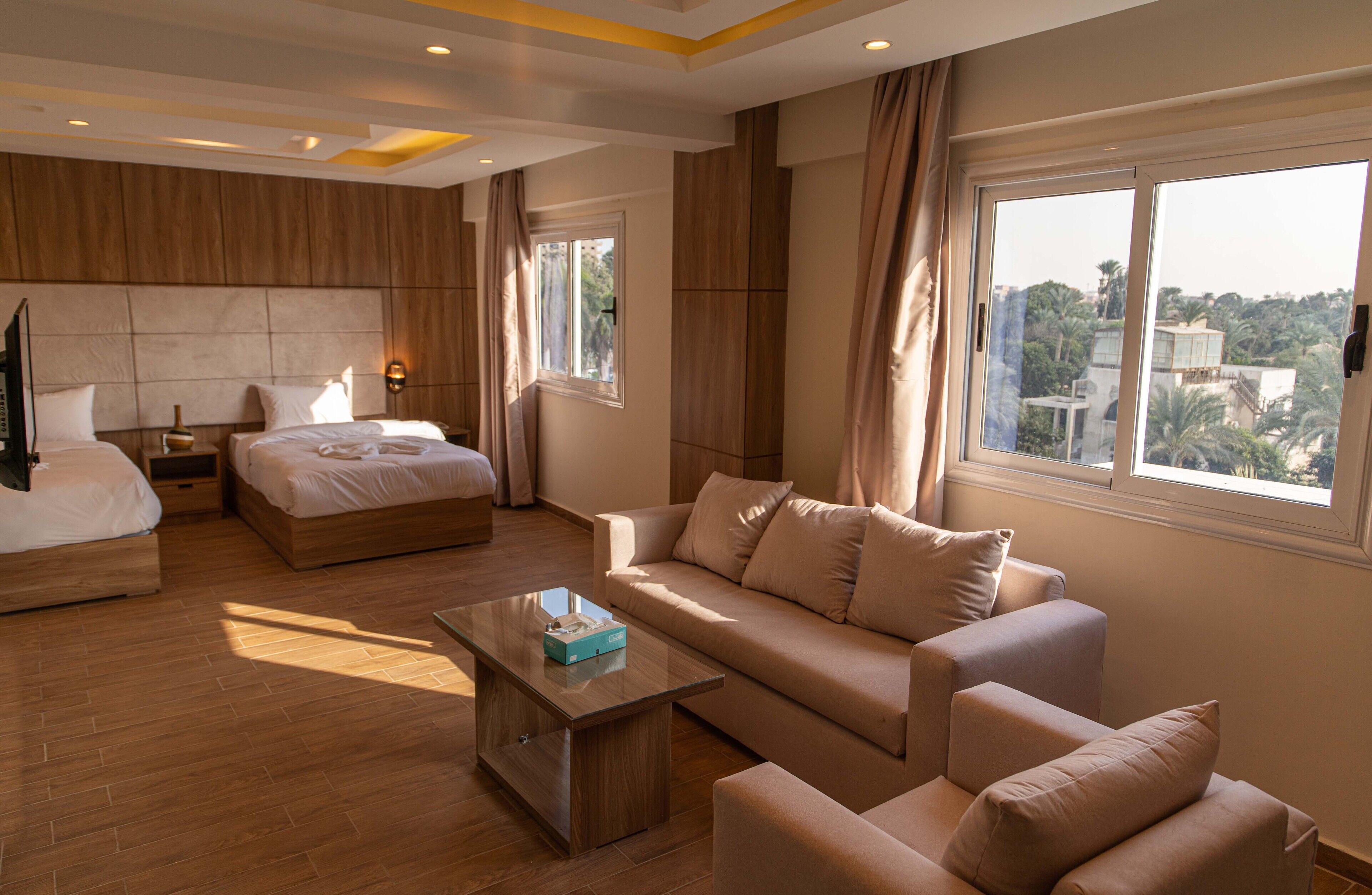 Suite with garden view | Premium bedding, down comforters, Select Comfort beds, minibar