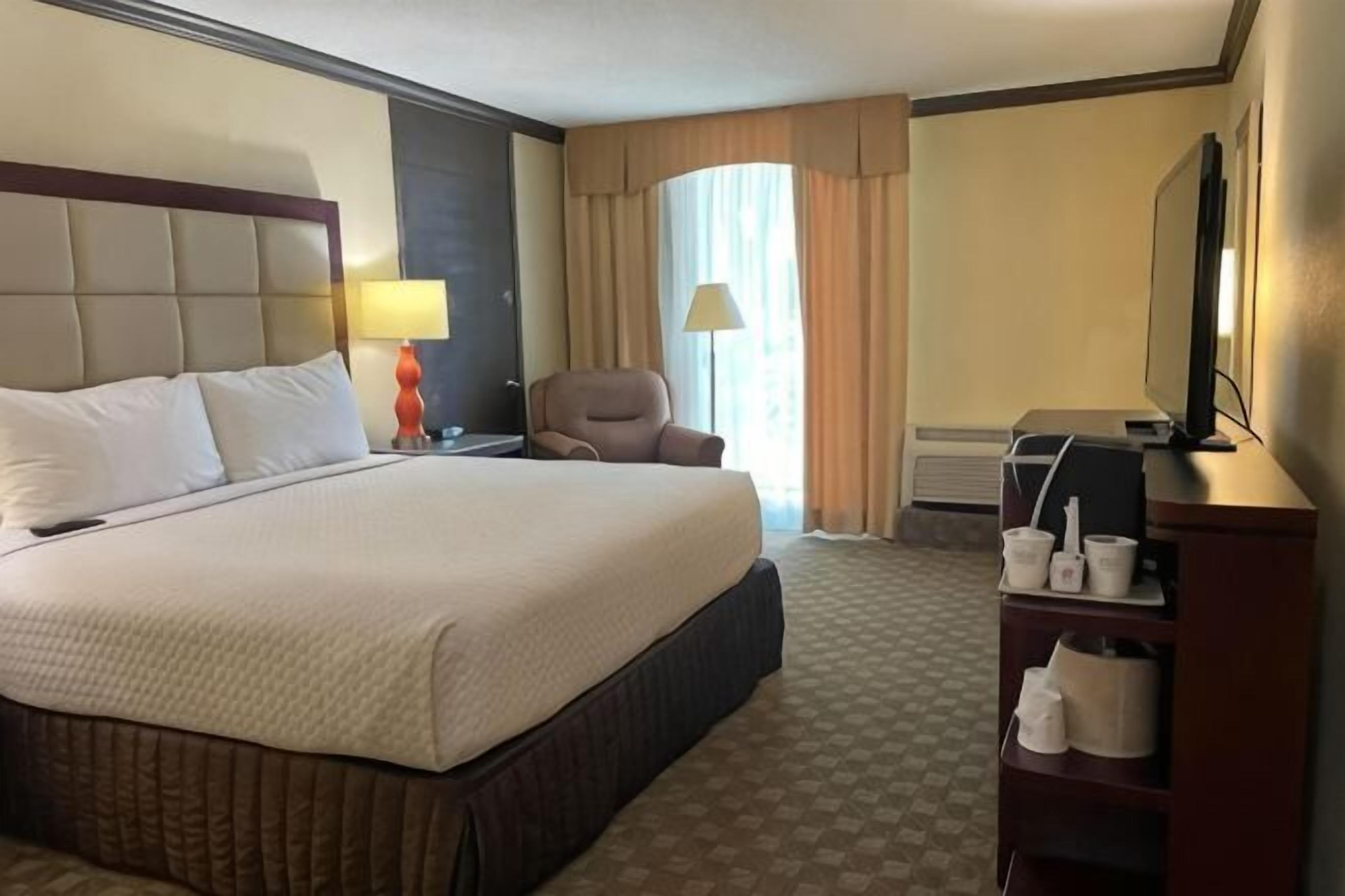 Desk, laptop workspace, blackout drapes, iron/ironing board