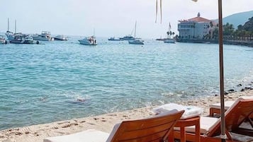 On the beach, sun loungers, beach towels