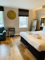 Hypo-allergenic bedding, desk, laptop workspace, iron/ironing board