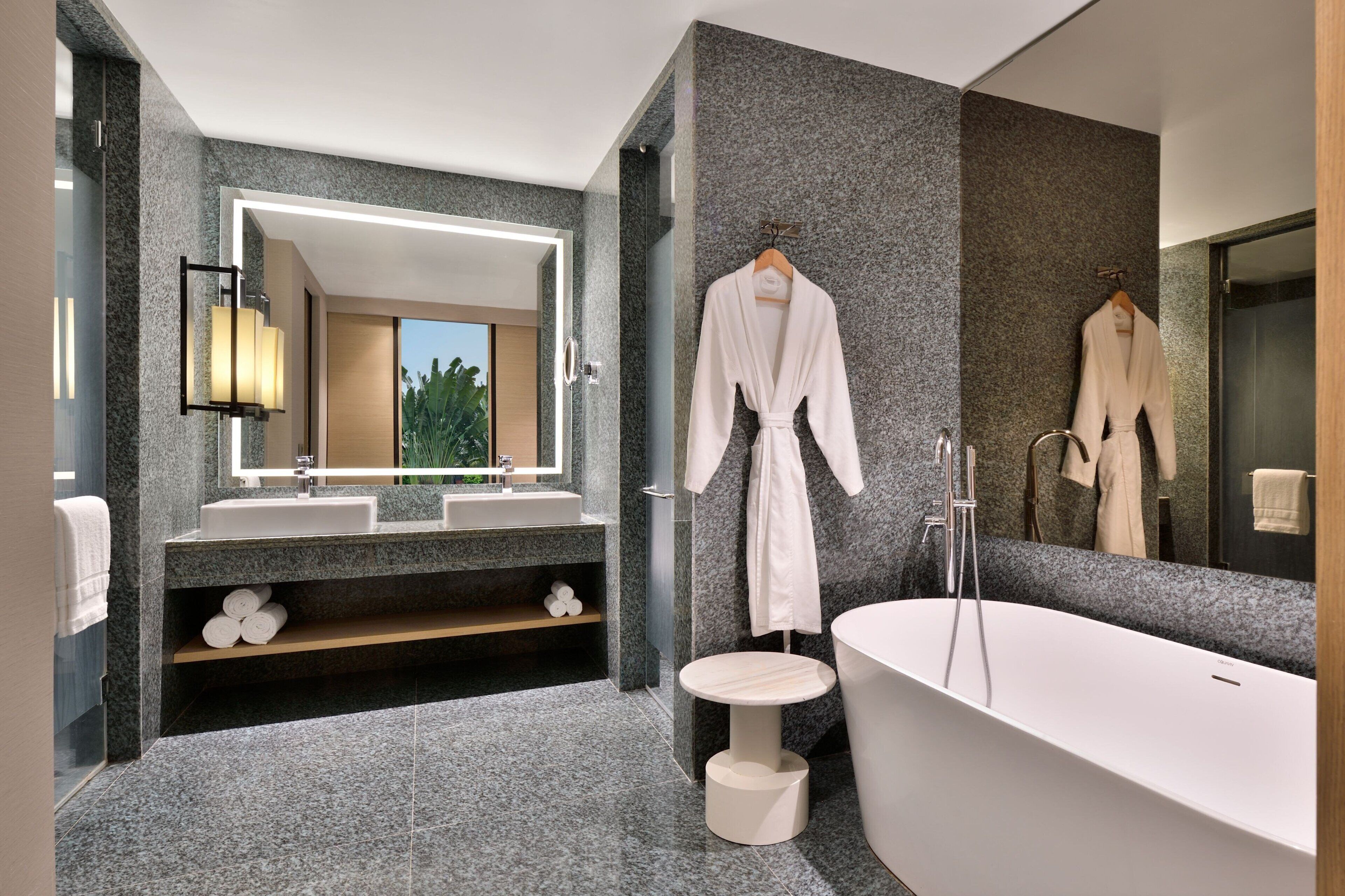suite, 1 king bed | bathroom | separate bathtub and shower, rainfall showerhead, free toiletries