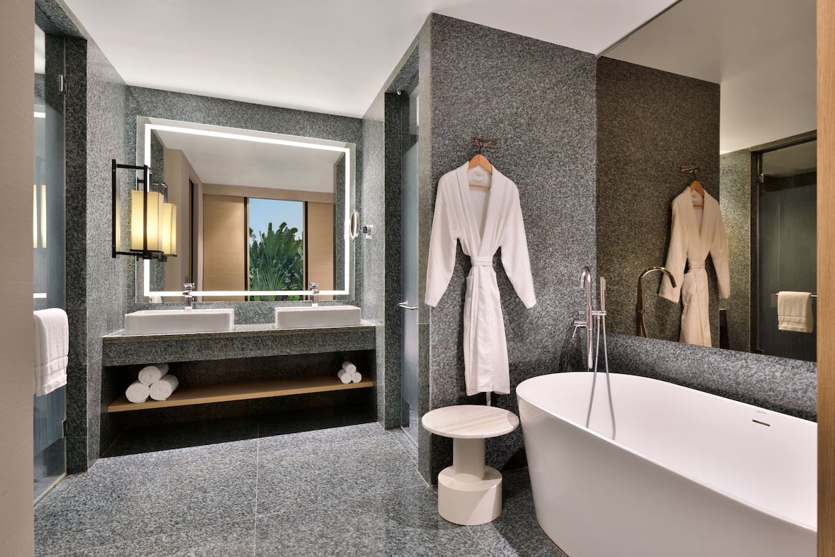 suite, 1 king bed | bathroom | separate bathtub and shower, rainfall showerhead, free toiletries