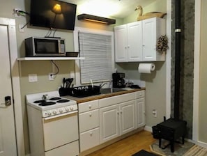 Fridge, microwave, toaster, cookware/dishes/utensils