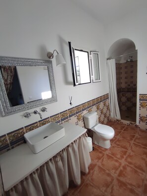 Shower, towels, soap, toilet paper