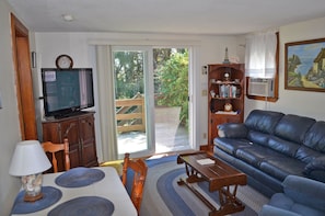 Living room with tv and comfortable seating.