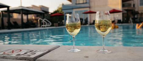 Outdoor pool, open 7:00 AM to 10:00 PM, pool loungers