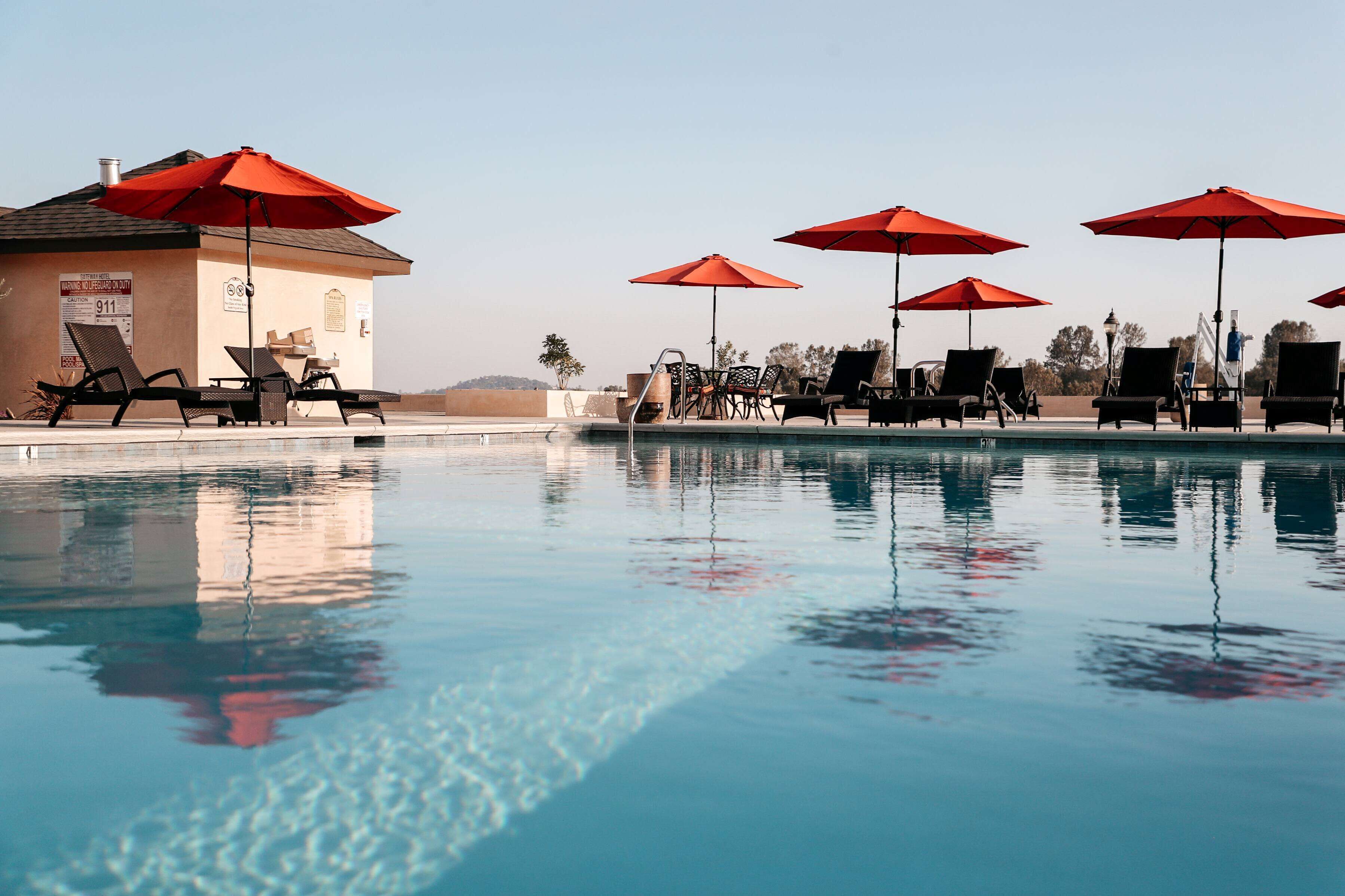outdoor pool, open 7:00 am to 10:00 pm, pool loungers