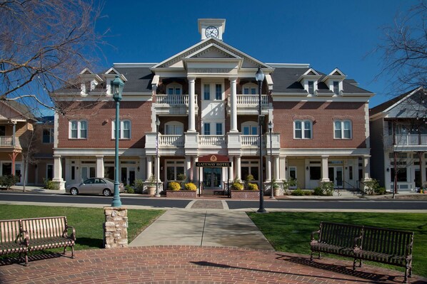 A brick building with a central entrance, balconies, and a sign reading "Gateway Hotel". - Gateway Hotel, Trademark Collection by Wyndham (Copperopolis)
